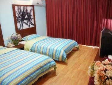 Xinlong Holiday Hotel Jiaozhou Exterior foto